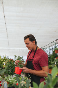 Woman standing in greenhouse