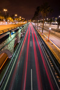 High angle view of light trails on road at night