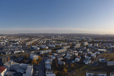 Sunset cityscape of modern city in autumn