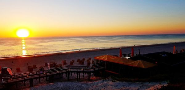 Scenic view of sea against clear sky during sunset