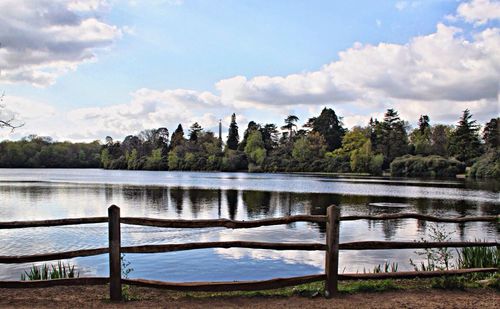 Scenic view of lake against cloudy sky