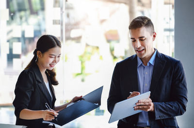 Business colleagues working in office