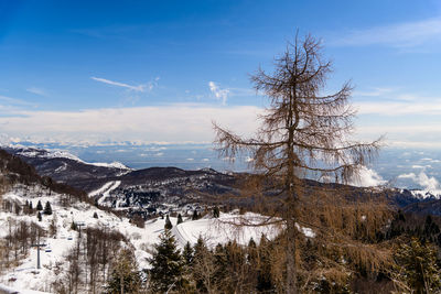 Scenic view of snowcapped mountains against sky