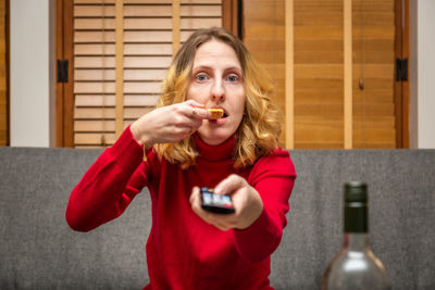 Portrait of woman eating food