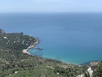 High angle view of sea and city