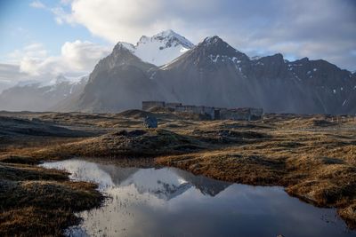 Scenic view of mountains and lake against sky