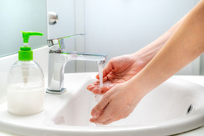 Midsection of woman in bathroom