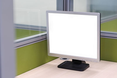 Close-up of blank computer monitor on desk at office