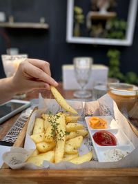 Midsection of person preparing food on table