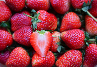 Selective focus on ripe strawberries cut in half ready put on group strawberry