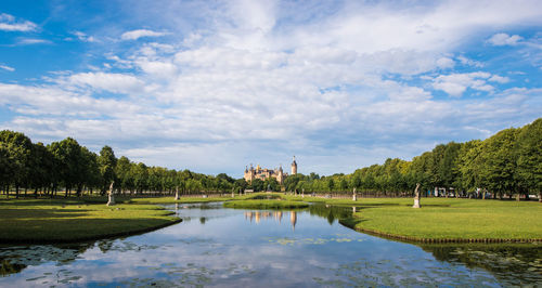 Schwerin castle and lake against cloudy sky