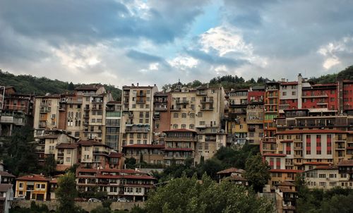 Buildings in city against sky