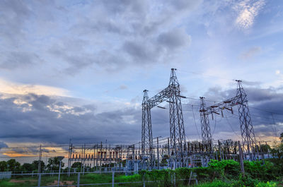 Low angle view of electricity pylon against sky