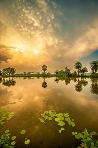 Scenic view of lake against sky during sunset