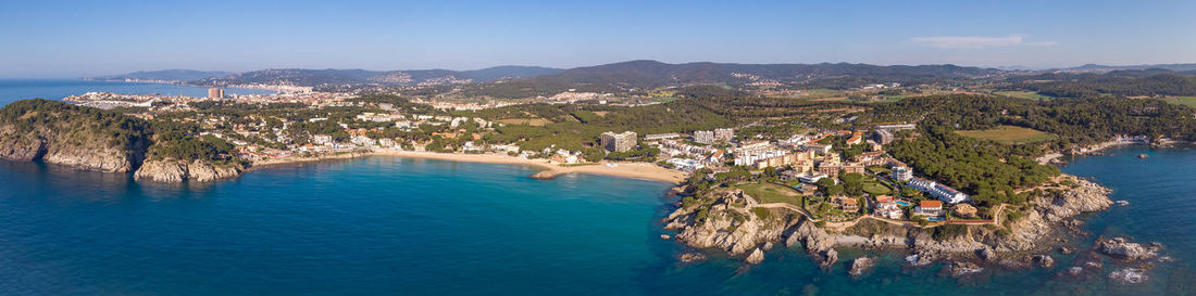 High angle view of sea and trees against sky