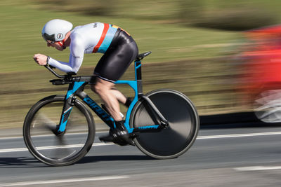 Man riding bicycle on road