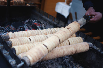 Cropped hands of man preparing food