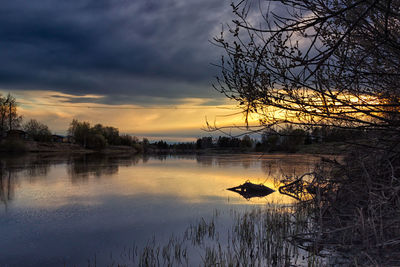 Scenic view of lake at sunset