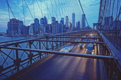 View of suspension bridge with city in background