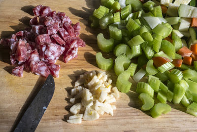 High angle view of chopped vegetables on cutting board