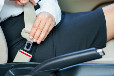 Midsection of man using mobile phone