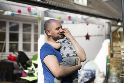 Father hugging child