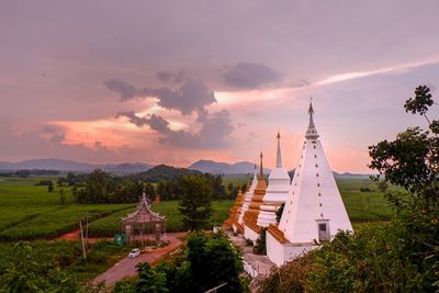 Traditional building against sky during sunset