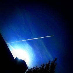 Low angle view of vapor trails in sky