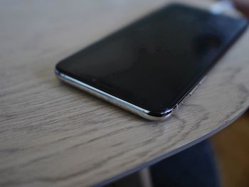 High angle view of smart phone on table