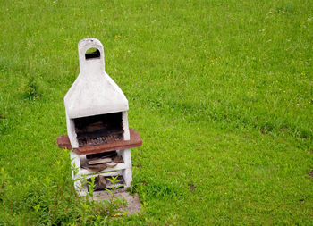 High angle view of brick oven on glass field