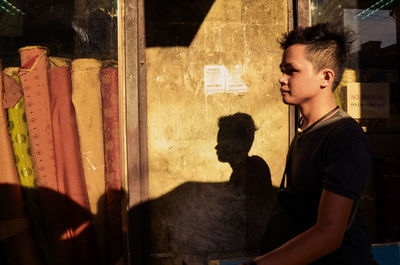 Side view of a young man looking away