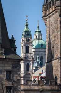 Low angle view of bell tower against sky