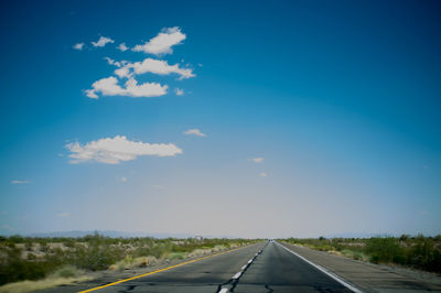 Empty road along landscape