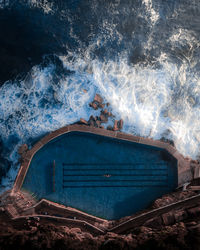 High angle view of swimming pool by sea