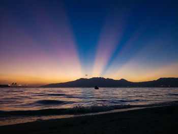 Scenic view of sea against clear sky during sunset