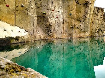 Close-up of old wall by swimming pool