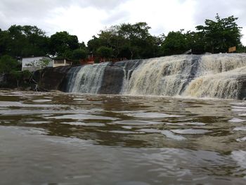 Water flowing in fountain against sky