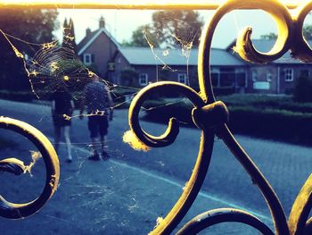 Close-up of metal wheel by swimming pool
