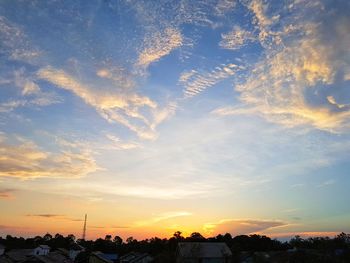 Silhouette trees against sky during sunset