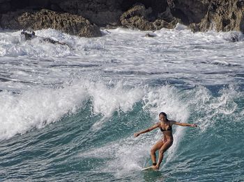 People surfing in sea