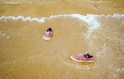 High angle view of shoes in sea