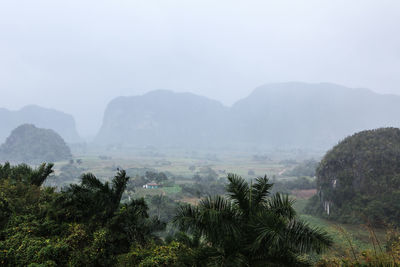 Scenic view of mountains in foggy weather