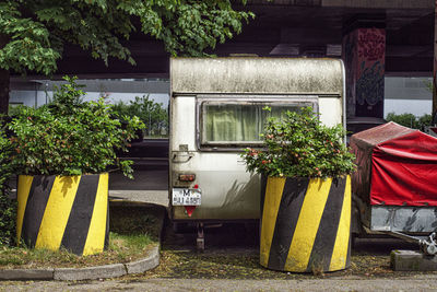 Old and dirty caravan parked under a bridge in the city of munich