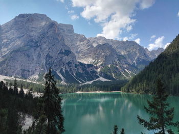 Scenic view of lake and mountains against sky