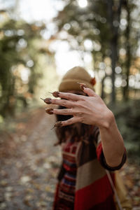 Cropped hand of woman holding hands