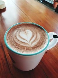 High angle view of cappuccino on table