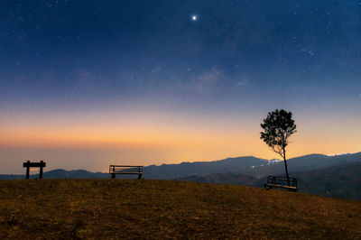 Scenic view of field against sky at night