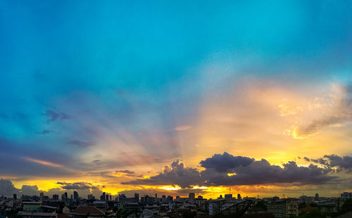 Panoramic view of buildings against sky during sunset