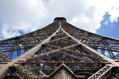 Low angle view of tower against cloudy sky