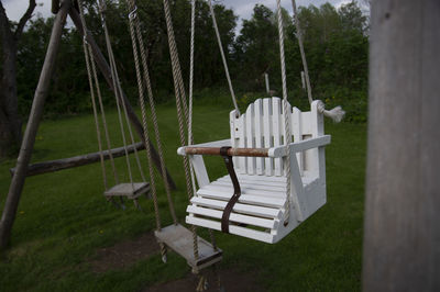 Empty swings in a garden